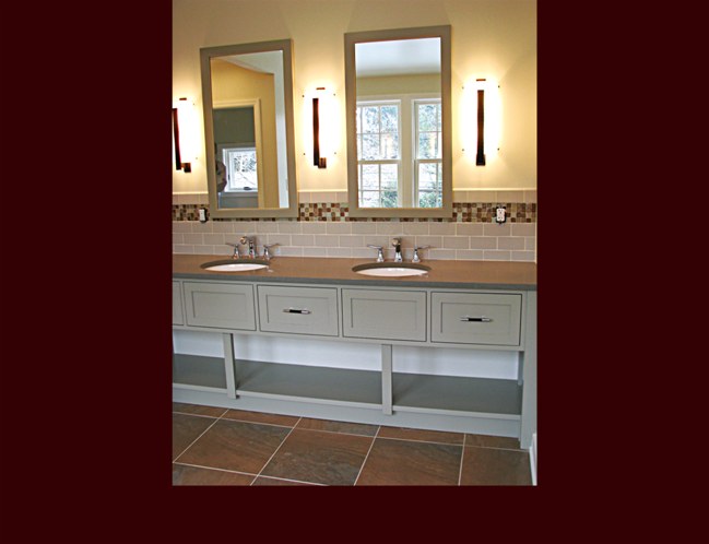 Open Vanity with double sink and stationary lower shelving.