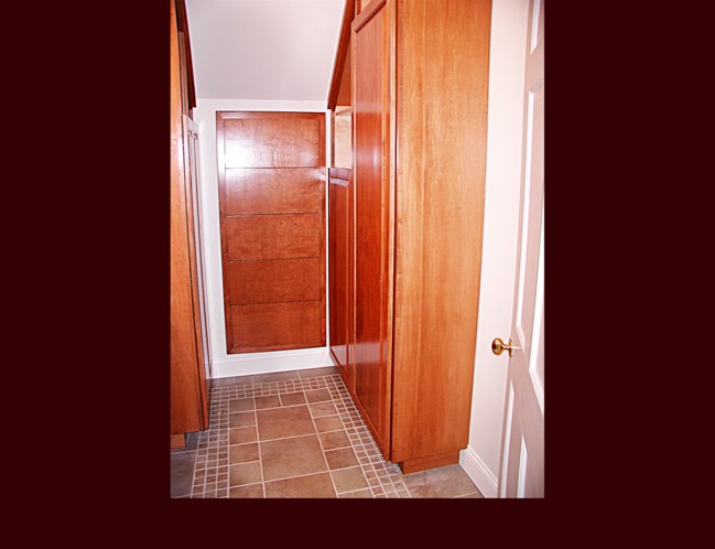 Bathroom cabinetry. Raised Panel Wardrobe built-ins with shelves. Drawer built-in under staircase.