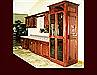 Custom Stained Mahogany Bar Cabinetry. Raised Panel door style. Full height media center with black glass. Decorative end panels. Crown Molding.