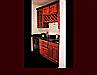 Cherry Butler's Pantry Cabinetry. Raised Panel door style. Cathedral door style on upper cabinets. Wine Rack with wine glass rack.